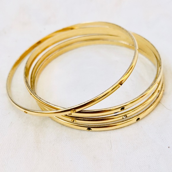 Vintage Jewelry - Gold metal set of bangles with gem details